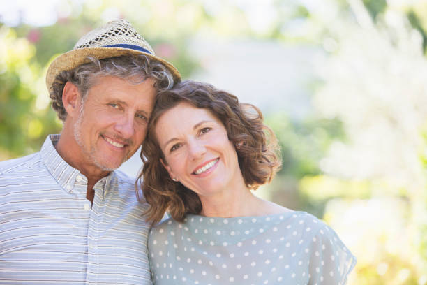 istock Older couple hugging outdoors 513438077