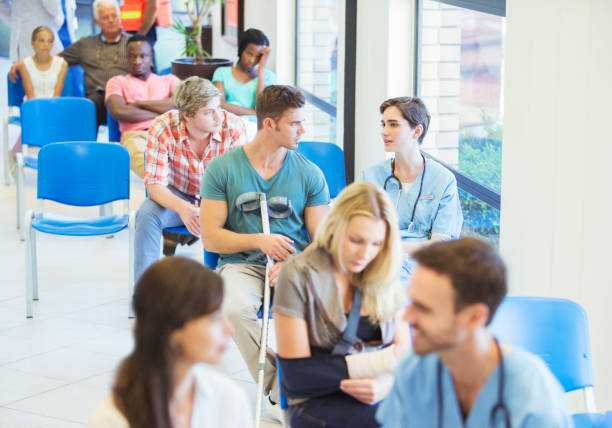 nurse and patient talking in hospital - emotional stress looking group of people clothing imagens e fotografias de stock