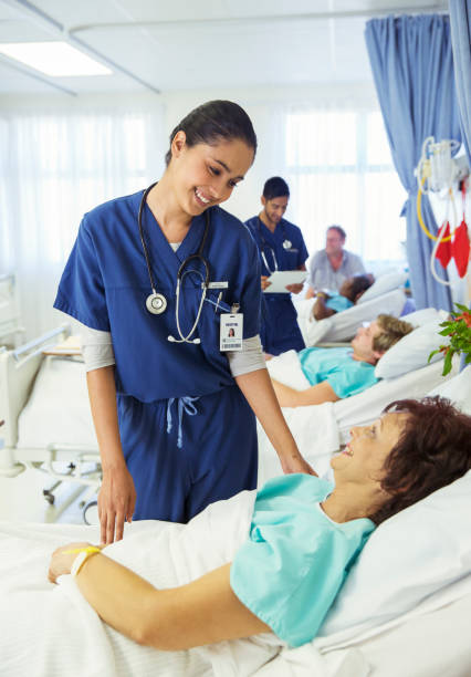 istock Nurse talking to patient in hospital room 513438111