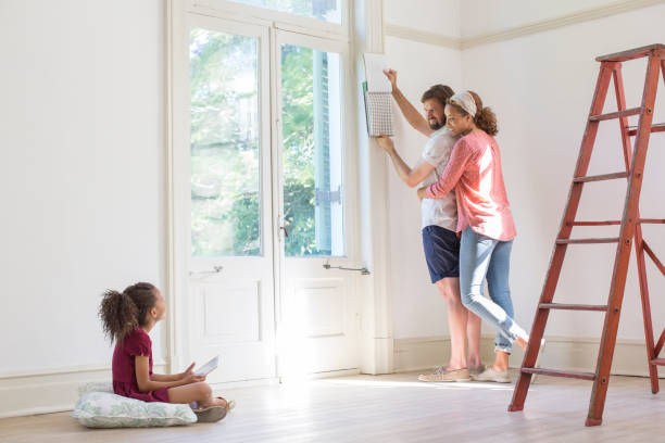istock Family fixing up new home together 513438117