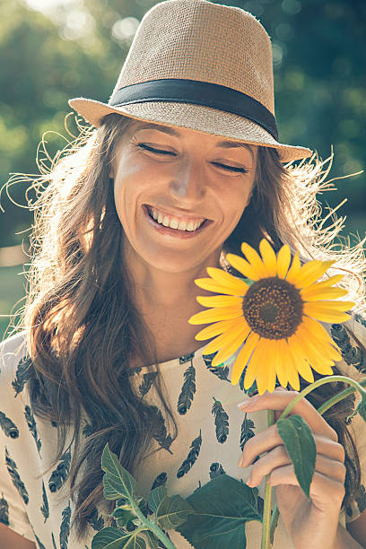 istock Girl holding sunflower 513438148