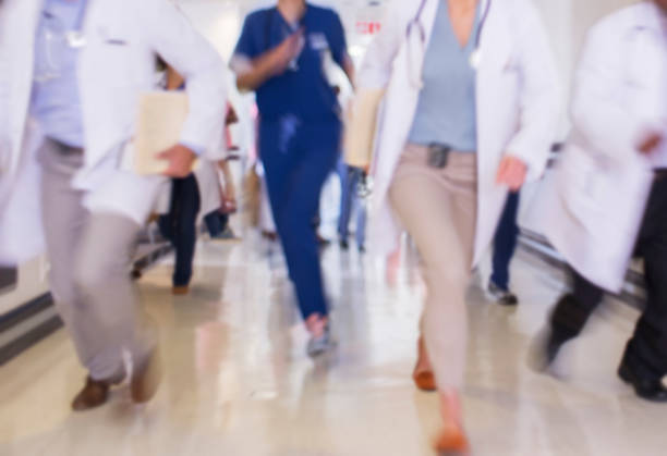 istock Doctors rushing in hospital hallway 513438155
