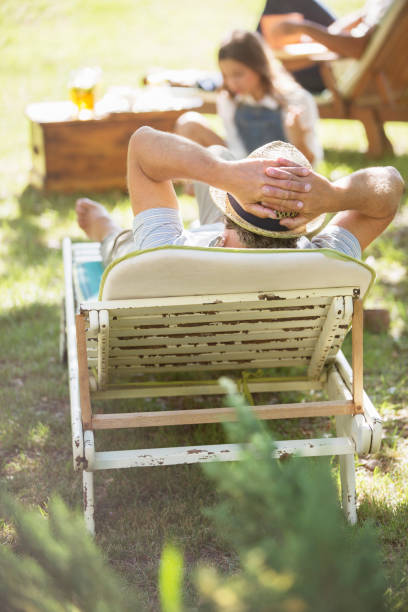 istock Older man relaxing on lawn chair 513438161