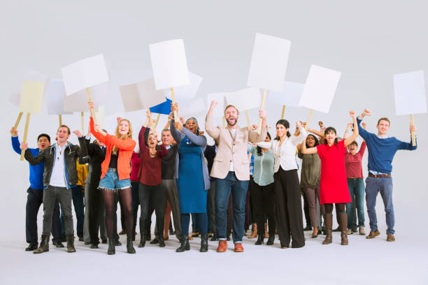 diverse crowd with picket signs - placard women holding standing imagens e fotografias de stock