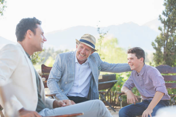 istock Three generations of men relaxing outdoors 513438215