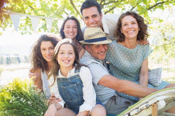 istock Family hugging outdoors at picnic 513438307