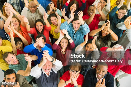 istock Portrait of diverse crowd clapping 513438481
