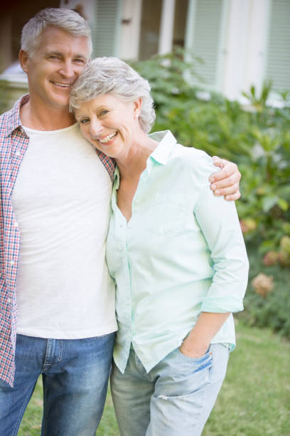 istock Older couple hugging outdoors 513438573