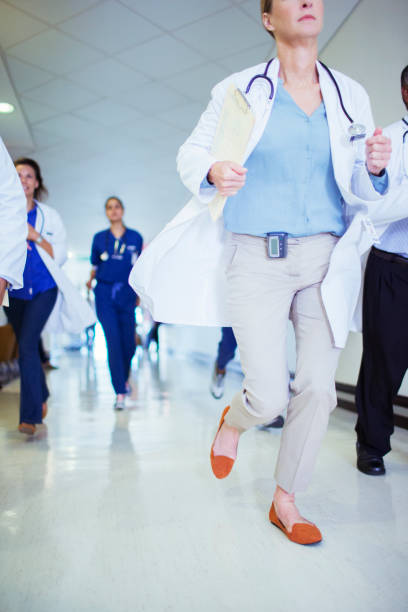 istock Doctor rushing down hospital hallway 513438631
