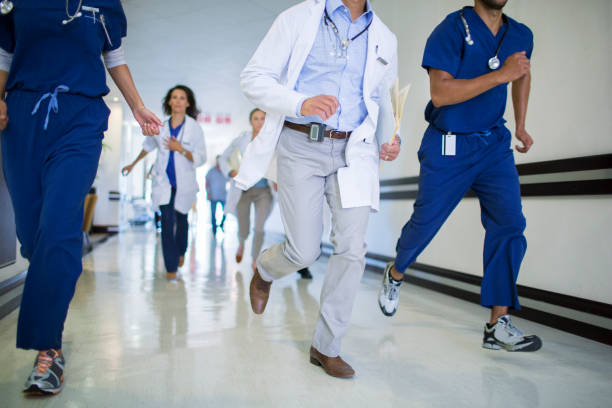 Health care workers rushed past emergency treatment hall, closeup of photo