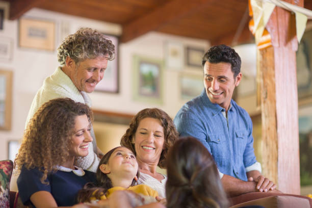 istock Family gathered on the couch together 513438719