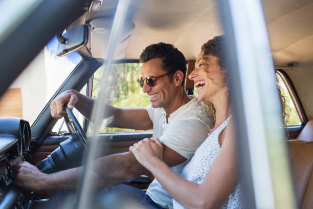 istock Couple riding in car on sunny day 513438747