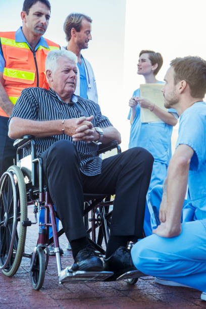 istock Nurse talking to patient outside hospital 513439049