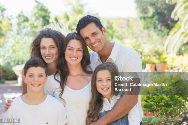 Family Hugging Outdoors Stock Photo - Download Image Now - Teenager, Father, Mother