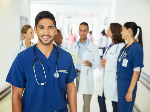 istock Nurse smiling in hospital hallway 513439299