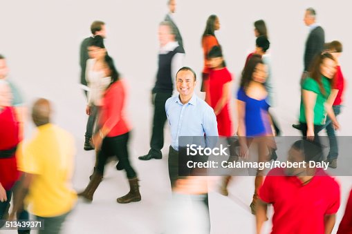 istock Portrait of smiling businessman standing out from the crowd 513439371