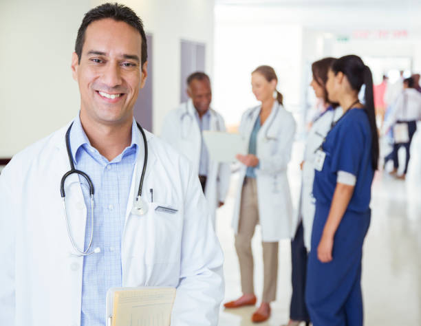 istock Doctor smiling in hospital hallway 513439503
