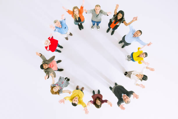 istock Business people with arms raised in circle 513439511