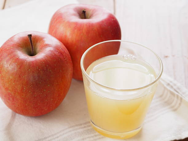 istock Glass of apple juice and fresh red apple 513439574