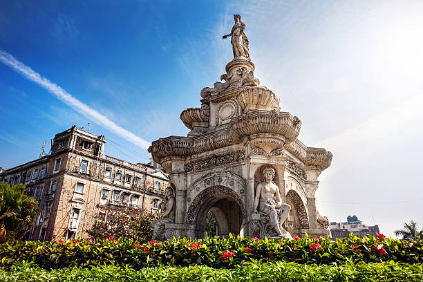 Flora Fountain in Mumbai Flora Fountain and Oriental Old Building at blue sky in sunny at fort area in Mumbai, Maharashtra, India mumbai stock pictures, royalty-free photos & images