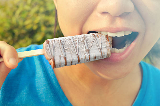 istock Happy woman eating ice cream 513441640