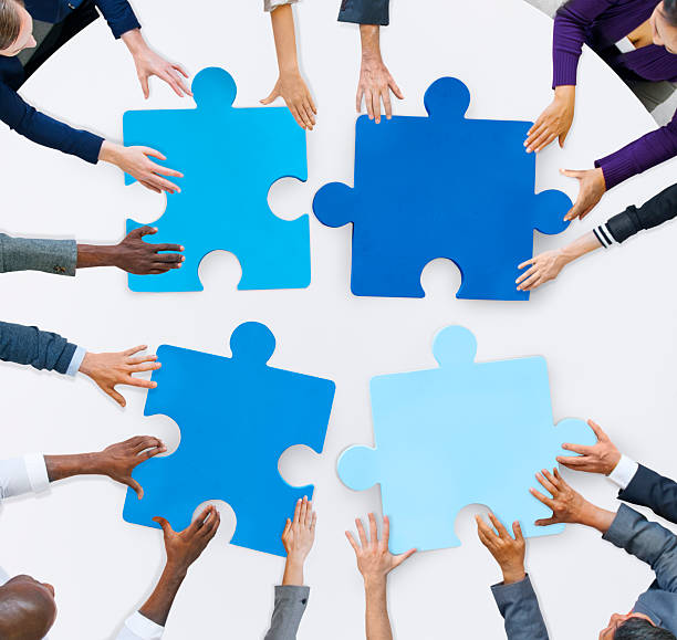 istock Business People and Jigsaw Puzzle Pieces 513443995