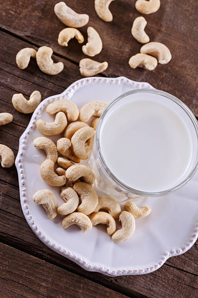 istock Vegan cashew milk over rustic wooden background 513444206