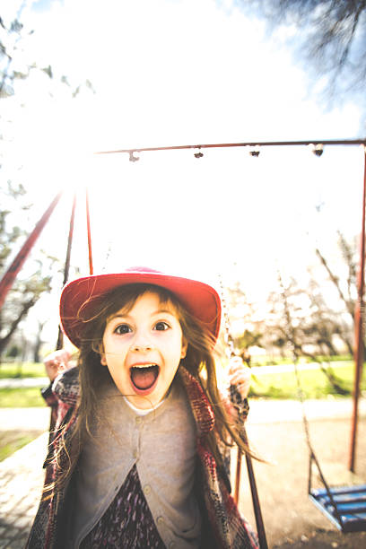 istock Screaming child on the swing 513444212