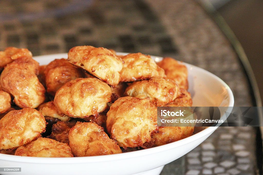 Gougeres / Cheese Puffs This particular French delicacy is served in a white bowl against a tiled colored background. Gougere Stock Photo