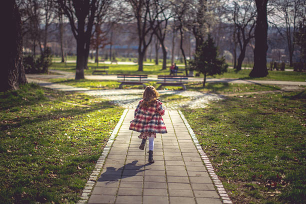 istock Happy girl running with spring twig 513444822