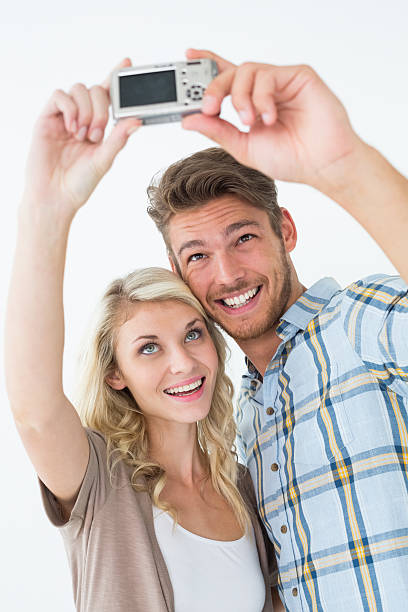 istock Attractive young couple taking a selfie together 513445717