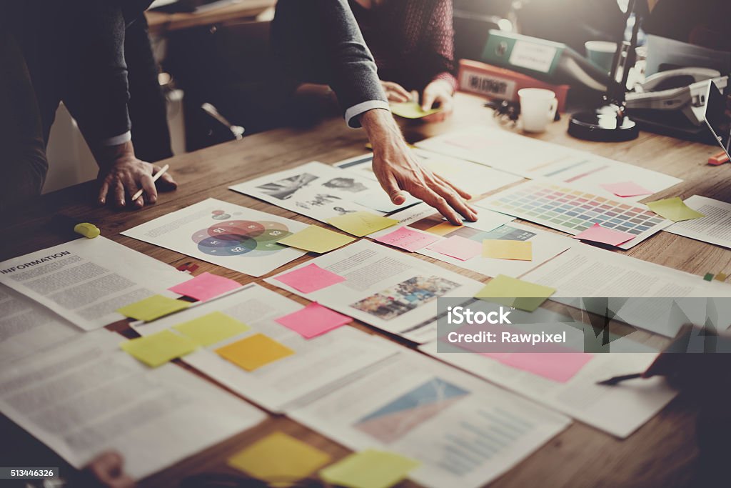 Business People Meeting Design Ideas Concept ***NOTE TO INSPECTOR: All visible graphics are our own design, and were produced for this particular shoot.*** Strategy Stock Photo