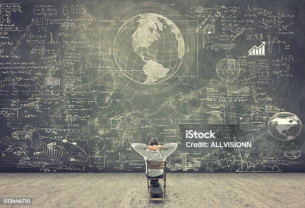 Businessman Watching Formulas Stock Photo - Download Image Now - Mathematical Symbol, Mathematics, Chalkboard - Visual Aid