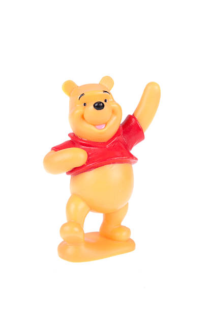 Pooh Bear Figurine Adelaide, Australia - December 20, 2015: A Pooh Bear figurine isolated on a white background from the popular A. A. Milne Winnie the Pooh stories. Merchandise from Winnie the pooh are highly sought after collectables. a.a. milne photos stock pictures, royalty-free photos & images