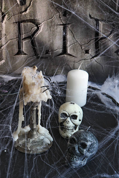 istock Halloween background with  tombstone, scull, candles, 513447099