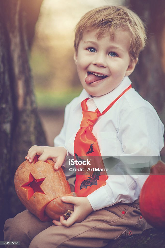 Boy celebrating Halloween Little boy at Halloween posing outdoors Boys Stock Photo