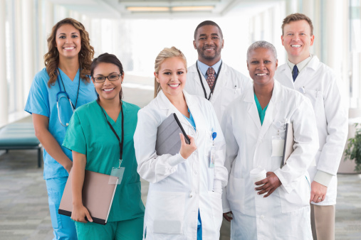 Large diverse group of hospital doctors, surgeons, and nurses