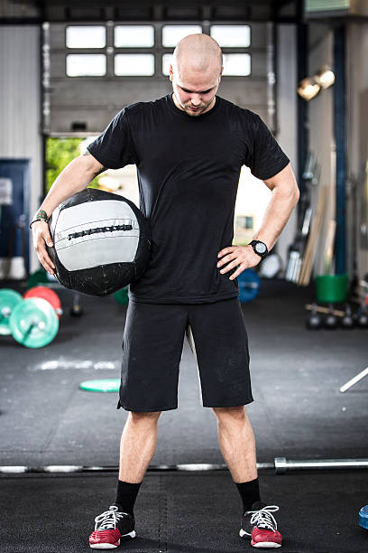 istock Well trained man with med-ball at the gym 513448089