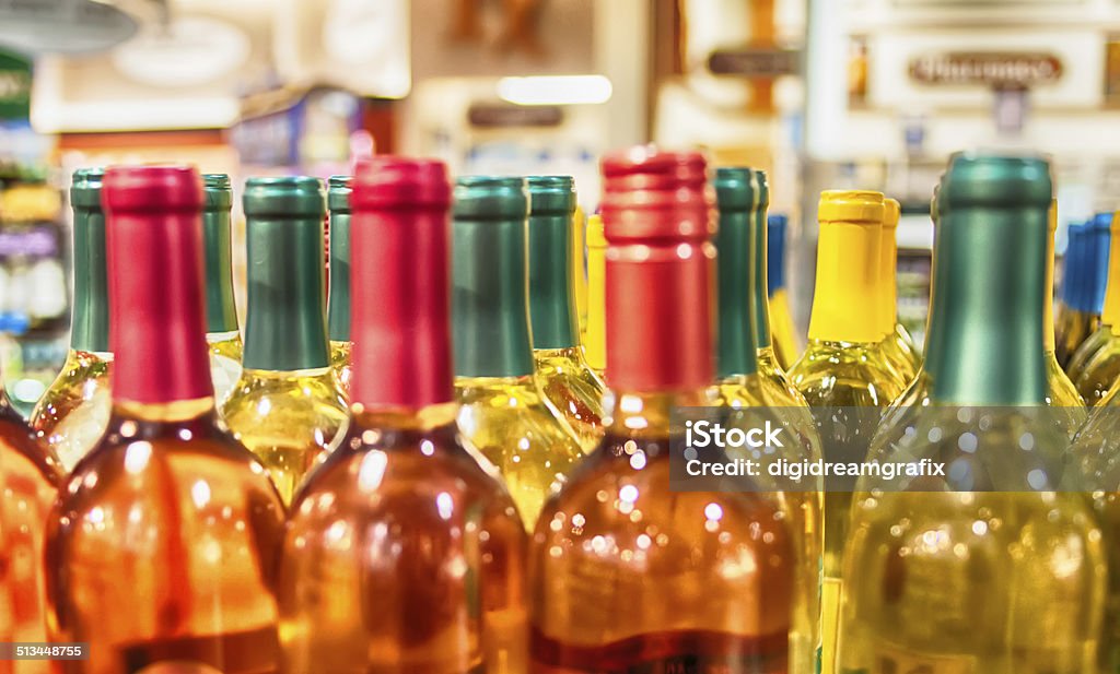 Bottles of wine shot with limited depth of field Bottles of wine on display in store Alcohol Abuse Stock Photo