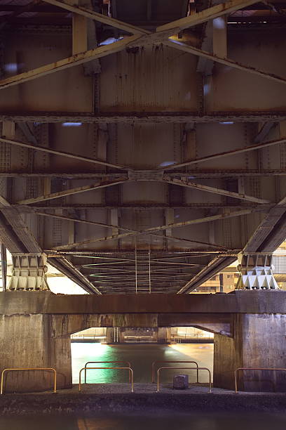 istock steel construction from under the old bridge at night time 513449857