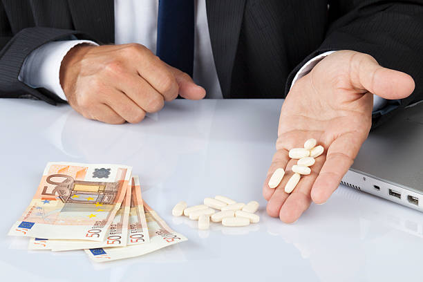 istock Pills and money 513469147