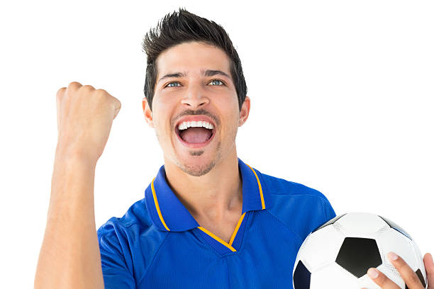 istock Athletic football player cheering 513469489
