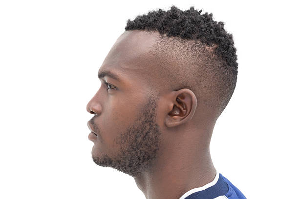 Man cutting his hair in a barber shop