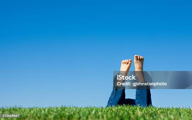 Leisurely Laying In The Grass Stock Photo - Download Image Now - Blue, Carefree, Child