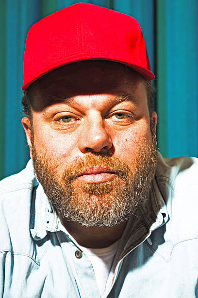 istock Man with beard and red cap. Portrait of a trucker. 513470429