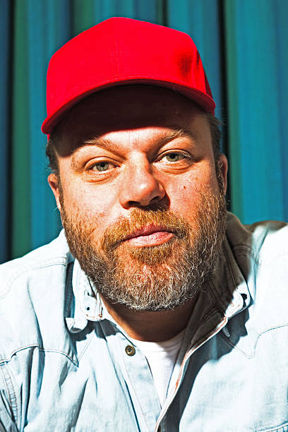 istock Man with beard and red cap. Portrait of a trucker. 513470469