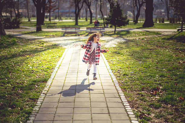 istock Happy girl running with spring twig 513470762