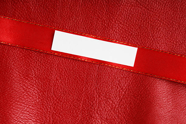 istock Piece scrap paper blank copy space on red leather background 513471183