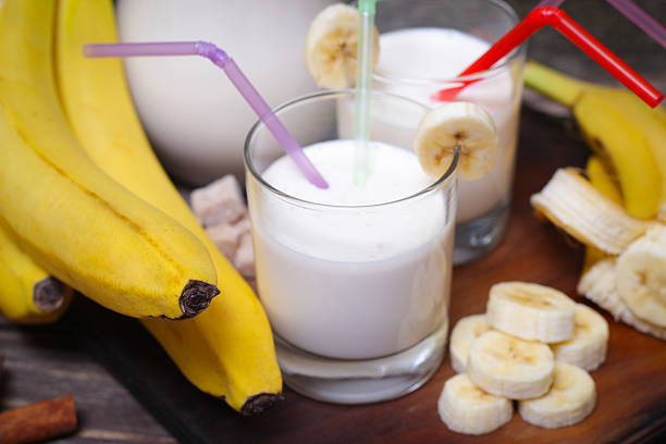 istock Fresh made Banana smoothie on wooden background 513471630