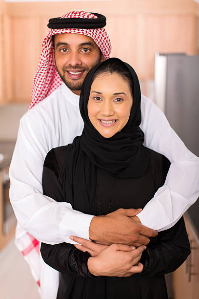 istock muslim man hugging his wife 513472328